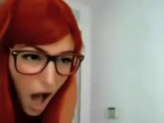 Mouth-watering redhead in glasses gives fine footjob to her fuck buddy 